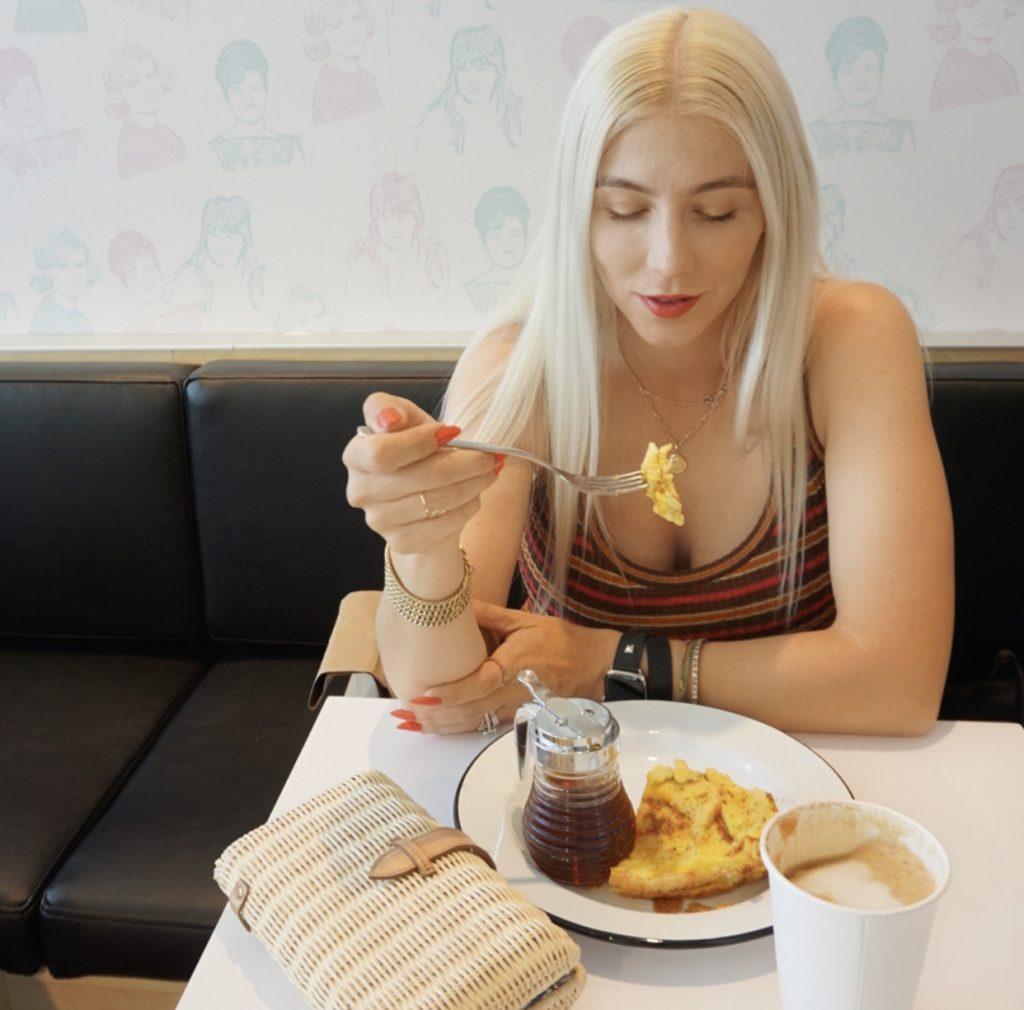 Katrina Olson eating breakfast at Chix Eggshop